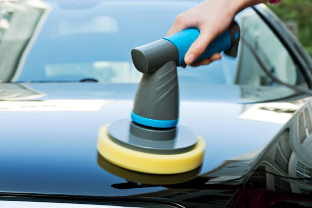 istock Woman hand using using a machine to polish vehicle hood 1094925586