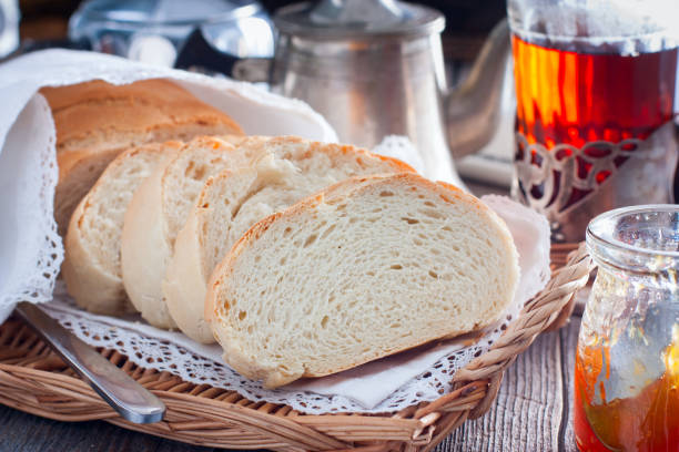 istock Homemade white bread in a rustic style, sliced, horizontal 1094925590
