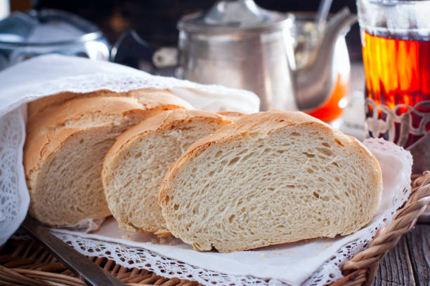 istock Homemade white bread in a rustic style, sliced, horizontal 1094925688