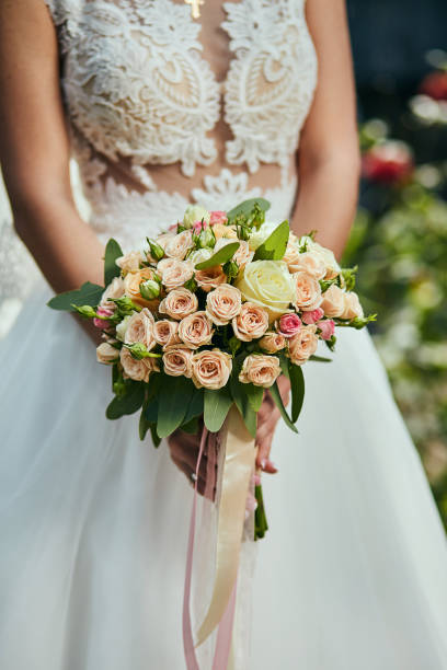 istock bouquet in hands of the bride, woman getting ready before wedding ceremony 1094935430