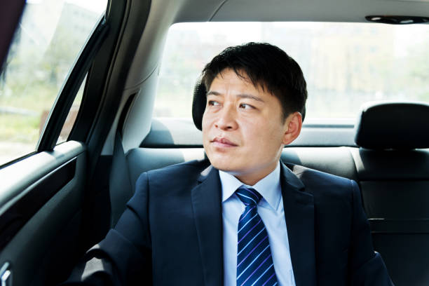 istock Businessman at back seat of car 1094939014