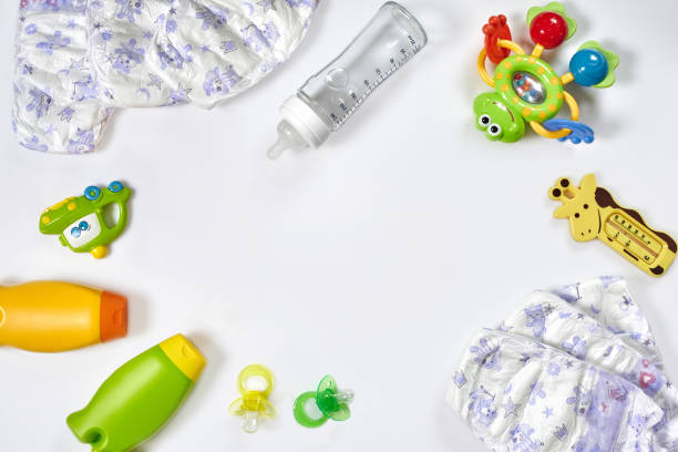 istock Set of accessories for baby. Pacifier, bottle, diaper, cream on white background. 1094939232