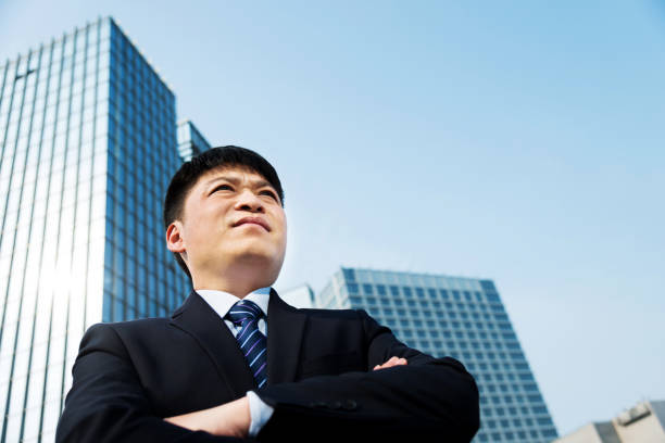 istock Businessman standing in front of office building 1094939440