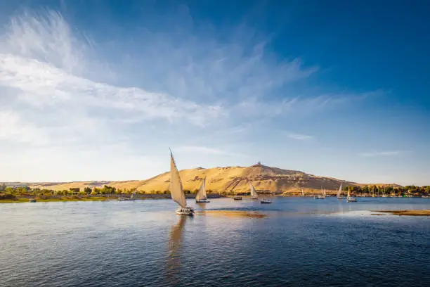 River nile with traditional boats at sunset. Live on the river Nile