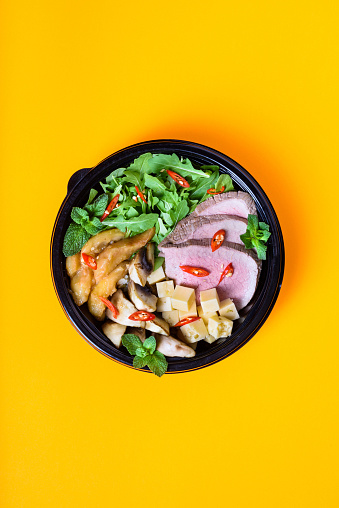 Hawaiian vegetarian poke bowl with beef. Ready-to-eat, to go fast food. Healthy ingredients. Top view, flat lay.