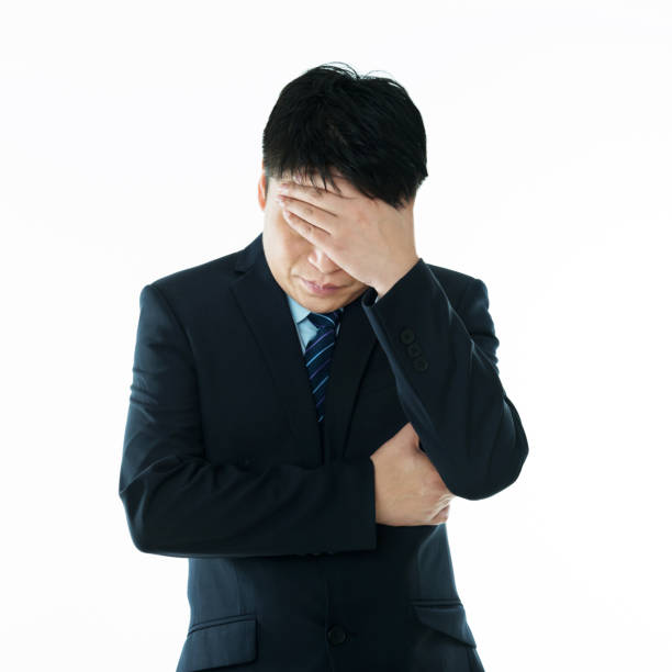 istock Businessman putting hand on forehead 1094942474