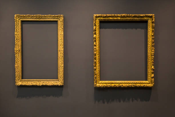 istock Set of vintage blank empty picture frames on grey wall 1094945458