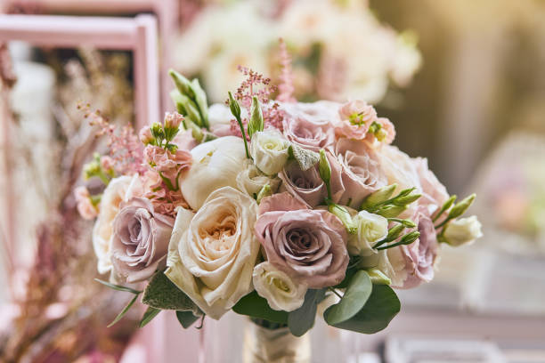 istock beautiful wedding bouquet with roses standing on the table 1094946088
