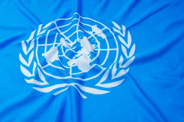Close up of United flags Fujian, China - April 6, 2017: Close up of United Nations flag.  The United Nations (UN) is an international organization whose stated aims are facilitating cooperation in international law, international security, economic development, social progress, human rights, and achievement of world peace. unicef photos stock pictures, royalty-free photos & images