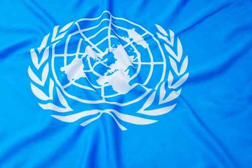 Fujian, China - April 6, 2017: Close up of United Nations flag.  The United Nations (UN) is an international organization whose stated aims are facilitating cooperation in international law, international security, economic development, social progress, human rights, and achievement of world peace.