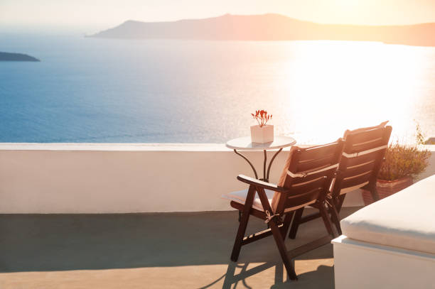 Relaxing benches to watch sunset in Santorini Island, Greece. View toward Caldera sea.