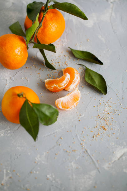 istock Fresh juicy orange tangerines on blue background close up. 1094952232