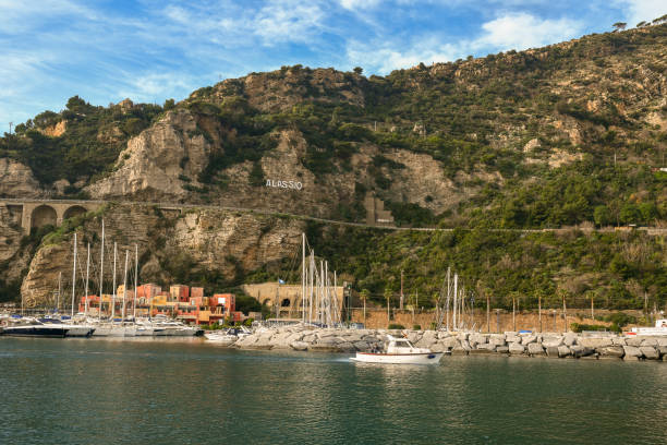 view of the harbor of alassio, liguria, italy - commercial dock pier reef rock imagens e fotografias de stock