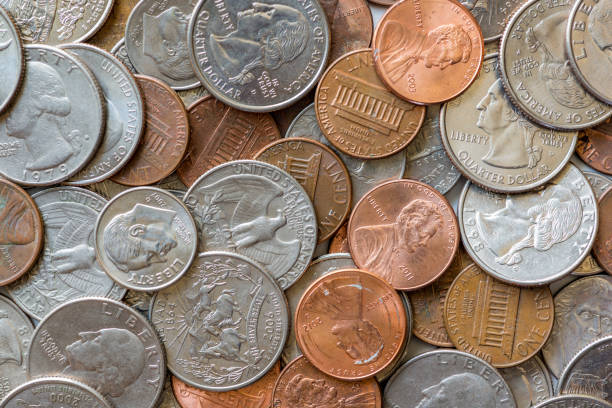 istock Close-up of a one cent, 10 cent and a quarter coins 1094954506