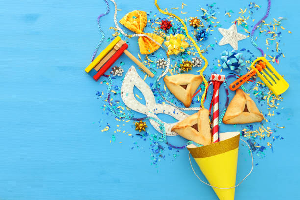 istock Purim celebration concept (jewish carnival holiday) over wooden blue background. 1094954844