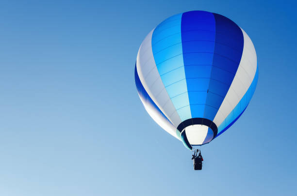 istock hot-air balloons flying in the blue clear sky 1094955444