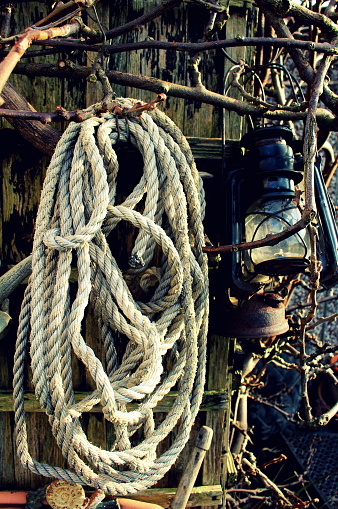 Three Rusty Old Lanterns Hanging On Shed Alongside Thick Rope Stock Photo -  Download Image Now - iStock