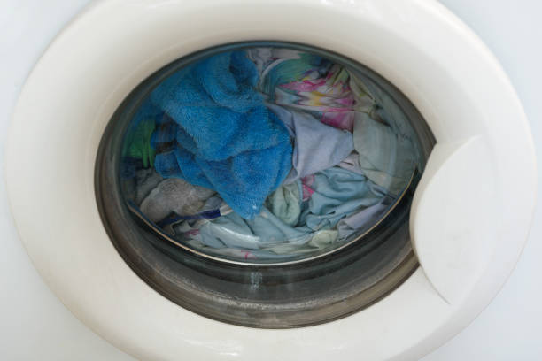 istock Washer. loaded laundry. filled drum washing machine. clean clothes 1094956936