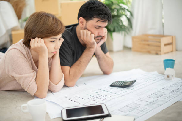 istock Stressed Young couple calculating their budget. 1094962122