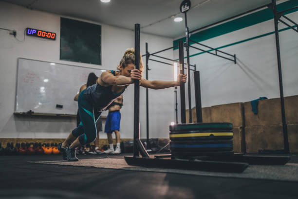 istock Female athlete exercising with weights 1094963066