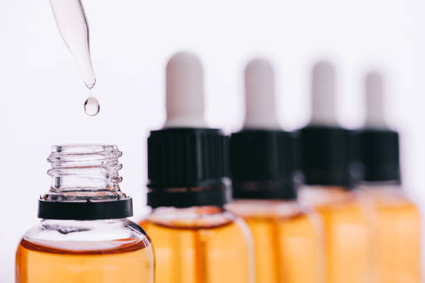 istock selective focus of cbd oil drop with dropper isolated on white 1094963084