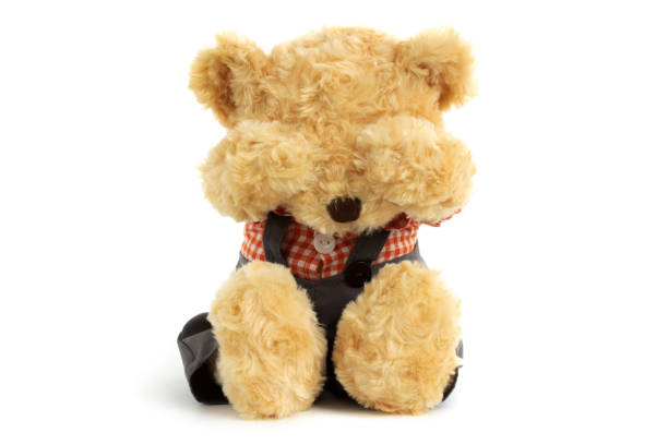 istock Teddy bear is sitting and very sad and crying on whine background 1094963846