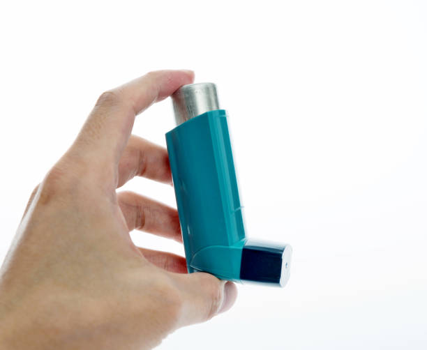 istock Man hand holding an asthma inhaler 1094965894