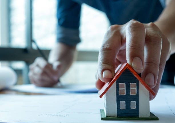 istock House design ideas,Young architects are drafting a house plan to present the project. 1094967340