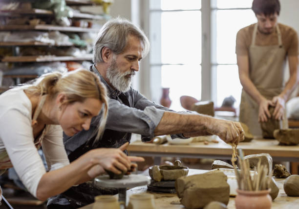 istock Small Group of People Creating Pottery 1094970592