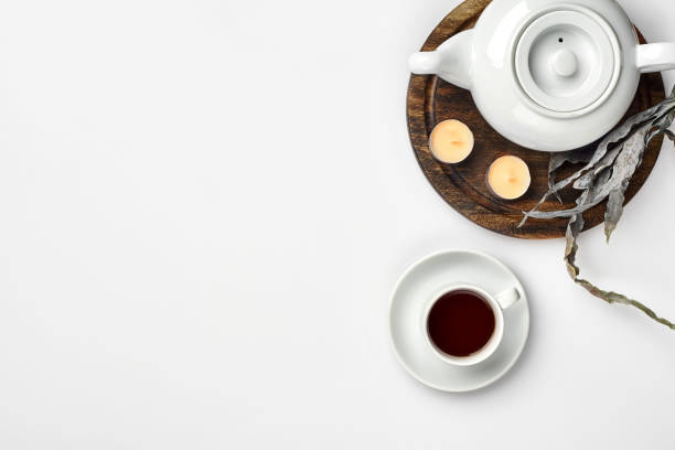istock Top view of the tea pot and tea cup on white background 1094974504
