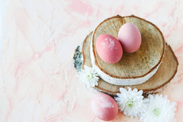 istock Pink, Easter eggs on a wooden stand. 1094975052