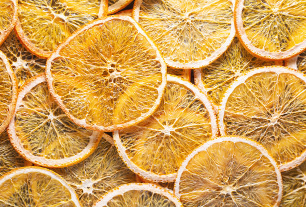 istock Slices of dry oranges as background or texture 1094977350