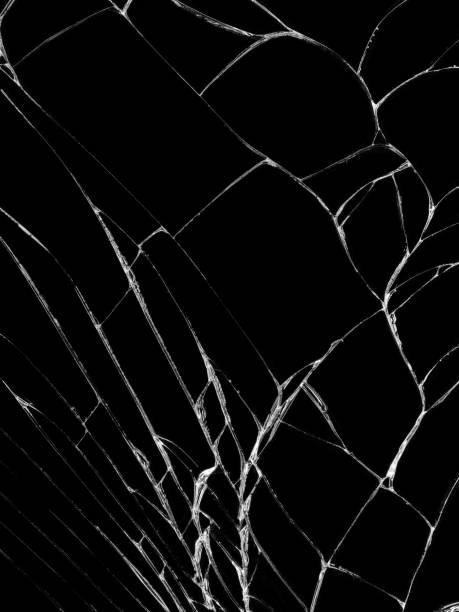 istock Cracked glass texture on black background 1094977670