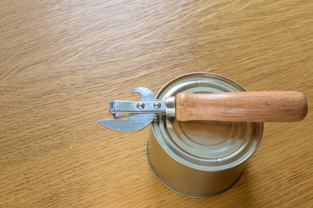istock tin can and an opener on the table 1094978450