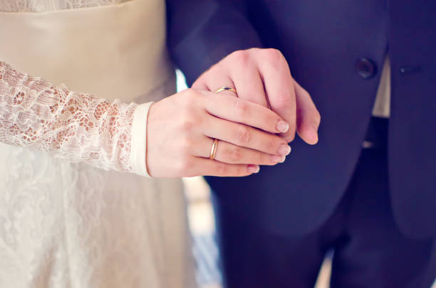 istock Newly wedding couple's hands with wedding rings 1094978574