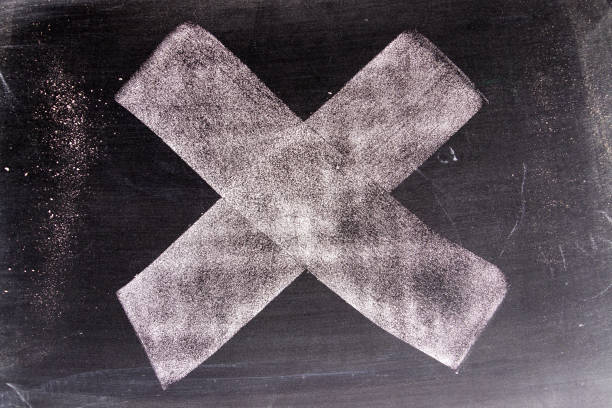 istock White color chak hand drawing in cross or x shape on blackboard background 1094980676