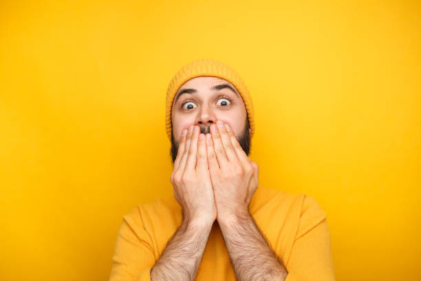 Frightened man in yellow clothes