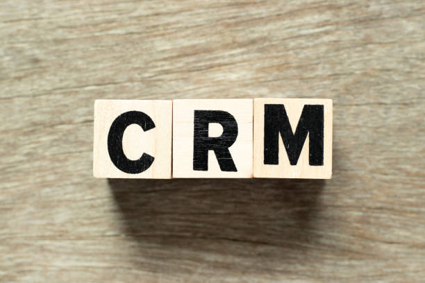 istock Letter block in word (Abbreviation of Customer Relationship Management) on wood background 1094981968