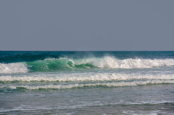 istock emerald wave swirling against the gray sky 1094982280