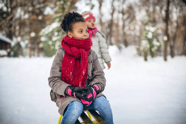istock Kids making winter memories 1094982486