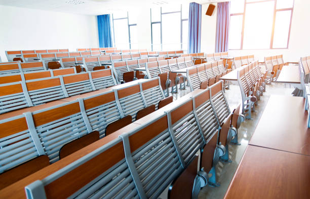 istock Desks and chairs in a lecture hall 1094987534