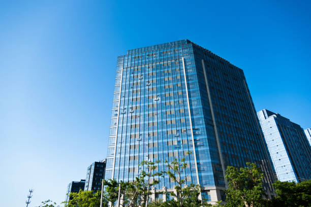 istock Business office buildings and trees 1094988232