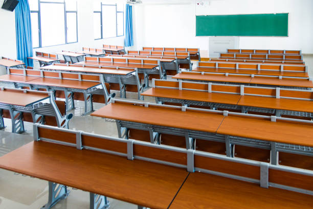 istock Desks and chairs in a lecture hall 1094992234