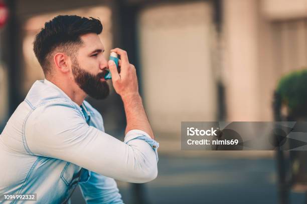 Men Using Asthma Inhaler Outdoor Stock Photo - Download Image Now - Asthmatic, Asthma Inhaler, Chronic Obstructive Pulmonary Disease