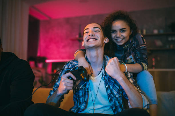 Couple celebrating victory in video games