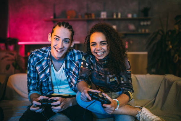 istock Couple playing video games at home 1094994926