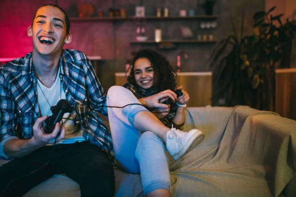 istock Couple playing video games at home 1094995012