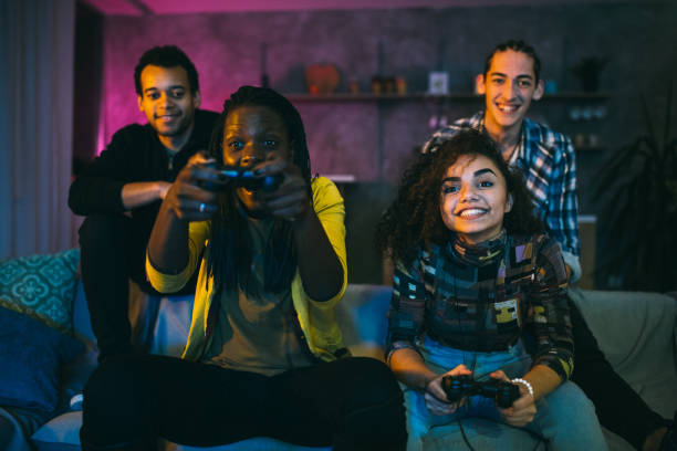istock Happy female friends playing video games 1094995228
