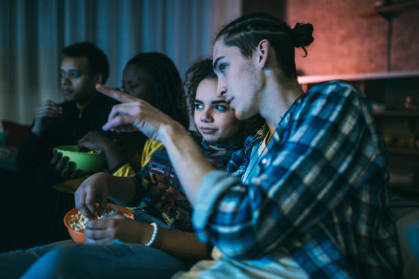 istock Beautiful couple watching movie 1094995638