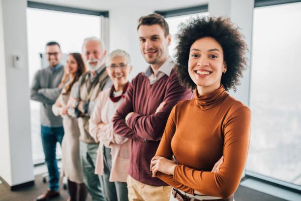 istock Businesswoman with work colleagues at office 1095002630